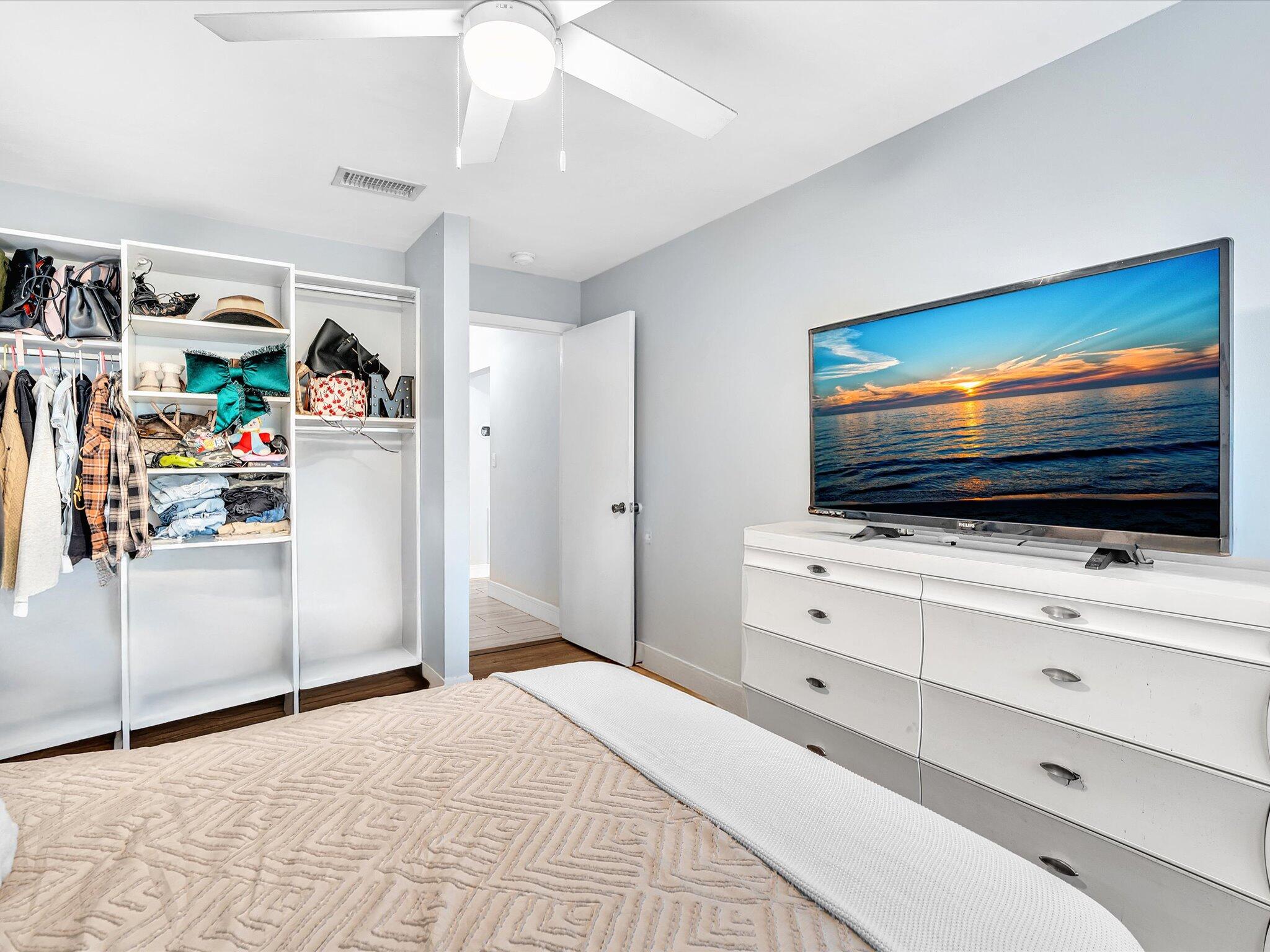 4441 Northwest 22nd Road, Unit 414 Coconut Creek, FL 33066 - Photo 33 of 60 a view of a livingroom with furniture and a flat screen tv
