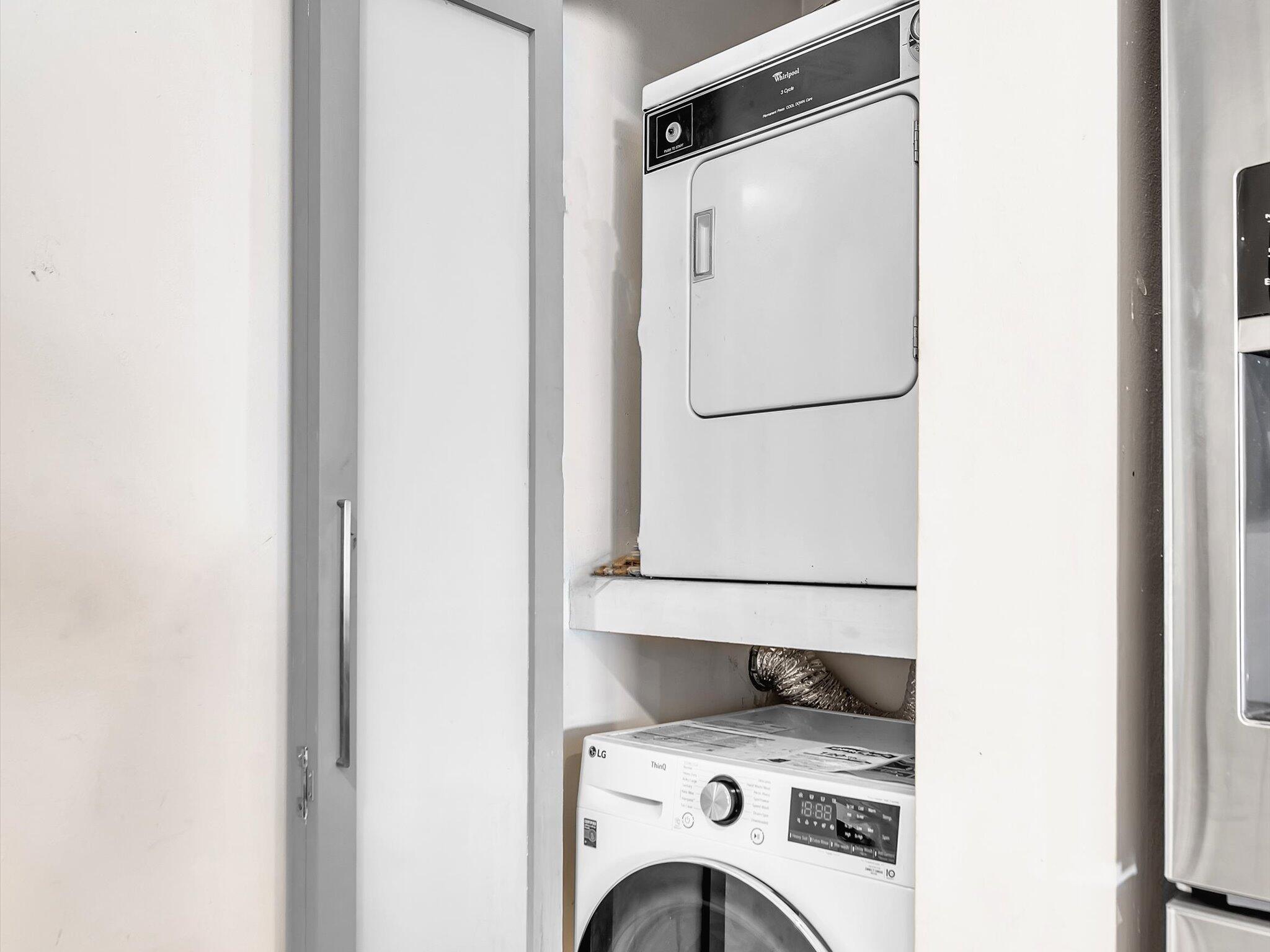 4441 Northwest 22nd Road, Unit 414 Coconut Creek, FL 33066 - Photo 34 of 60 a utility room with dryer and washer