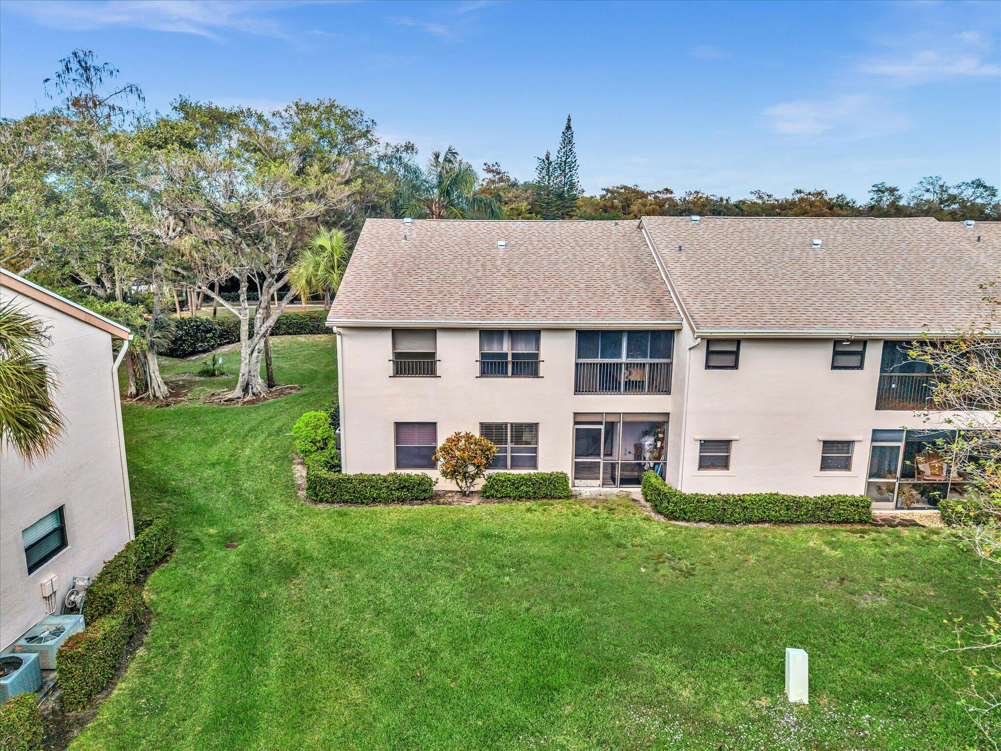 4441 Northwest 22nd Road, Unit 414 Coconut Creek, FL 33066 - Photo 40 of 60 a aerial view of a house with a yard patio and swimming pool