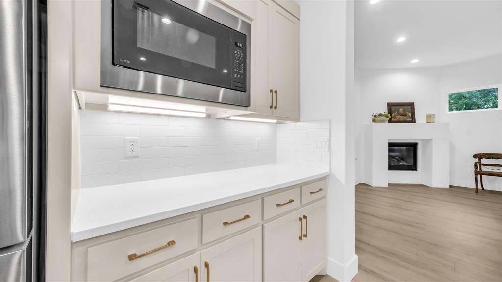 141 Lakeside Drive Lipan, TX 76462 - Photo 13 of 25 a view of a hallway with wooden floor and a fireplace