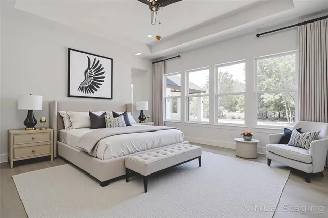 a spacious bedroom with a bed and a couch