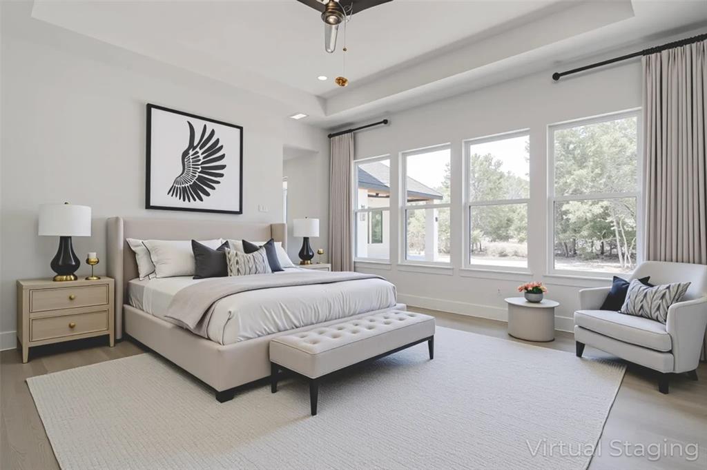 141 Lakeside Drive Lipan, TX 76462 - Photo 17 of 25 a spacious bedroom with a bed and a couch