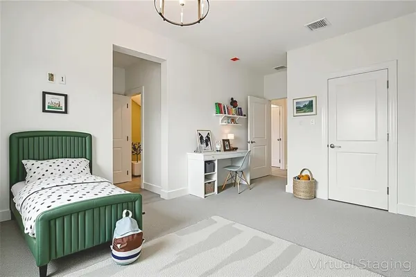 a bedroom with furniture and a wooden floor