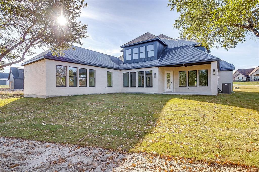 141 Lakeside Drive Lipan, TX 76462 - Photo 24 of 25 a front view of a house with swimming pool
