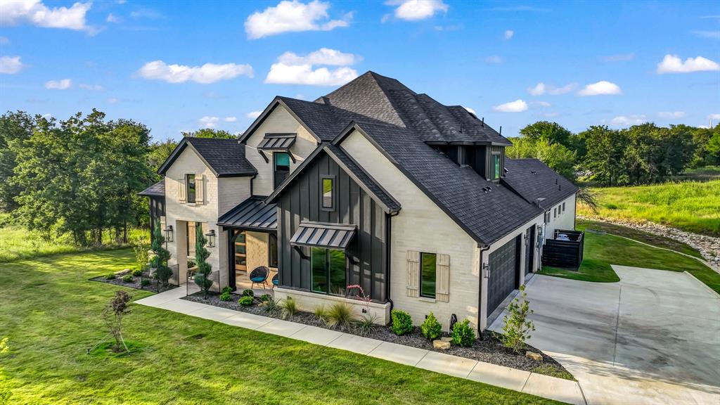 141 Lakeside Drive Lipan, TX 76462 - Photo 3 of 25 a front view of house with yard and green space