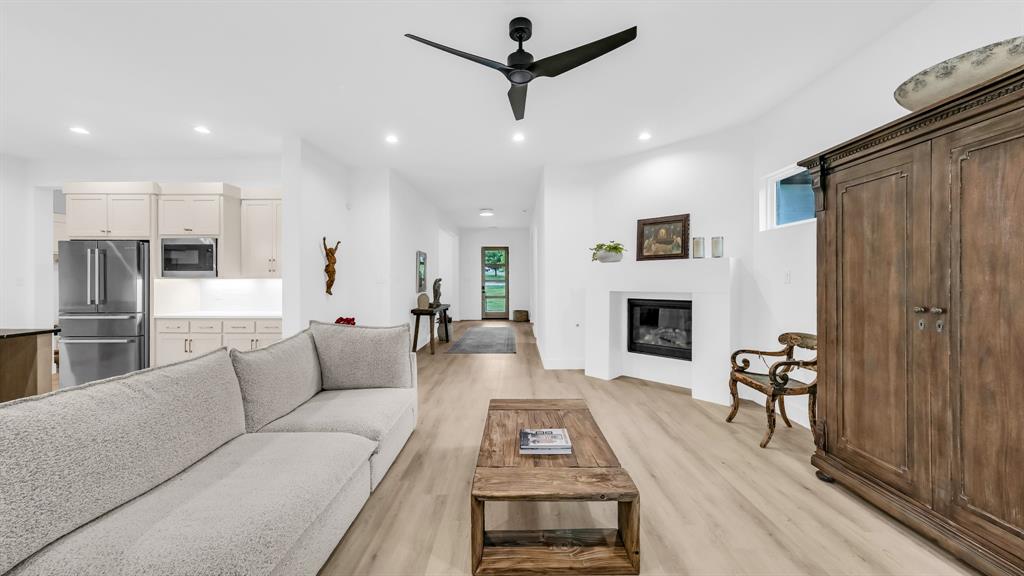 141 Lakeside Drive Lipan, TX 76462 - Photo 9 of 25 a living room with furniture and a fireplace
