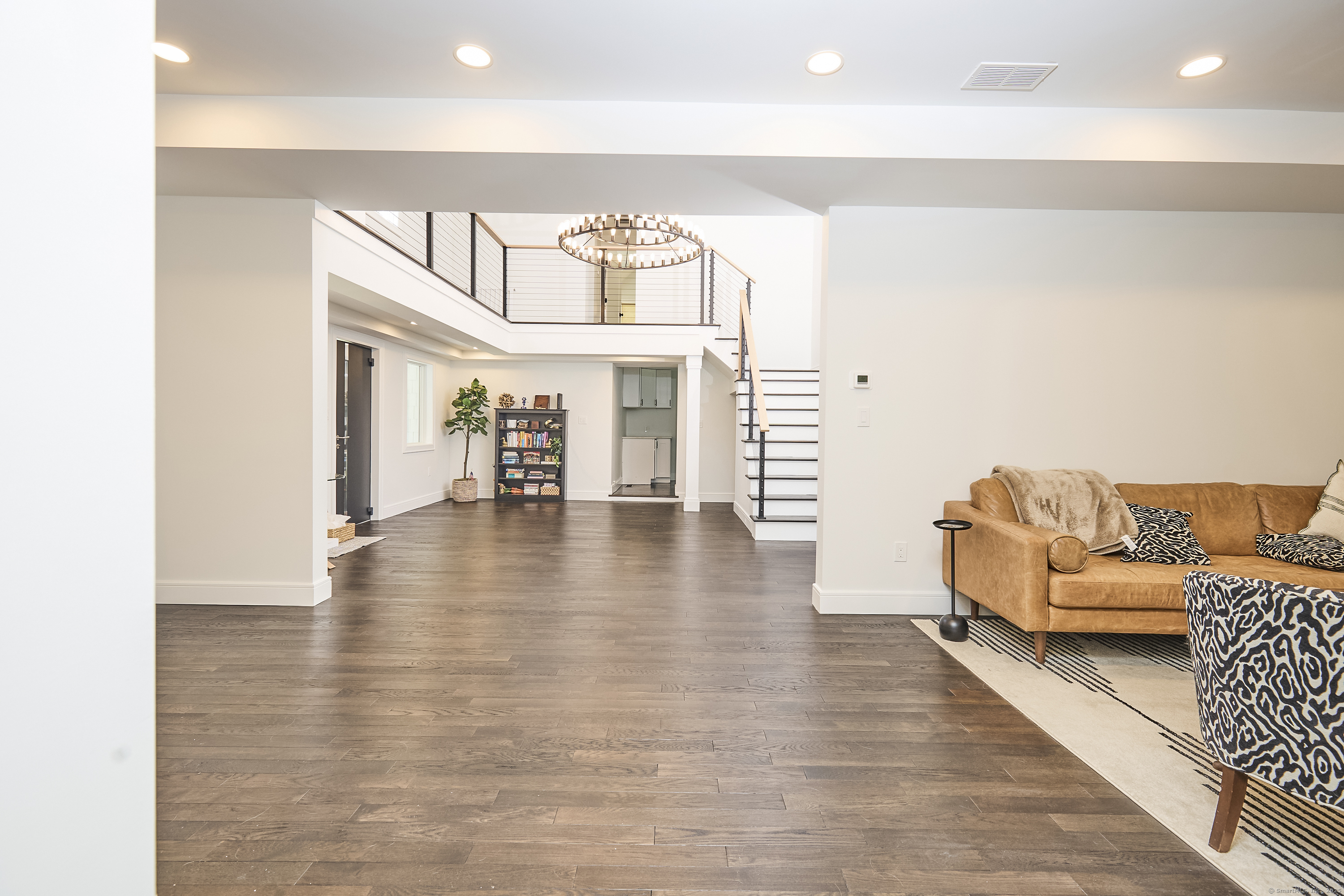 1207 Stillson Road Fairfield, CT 06824 - Photo 11 of 39 a view of livingroom with furniture and wooden floor