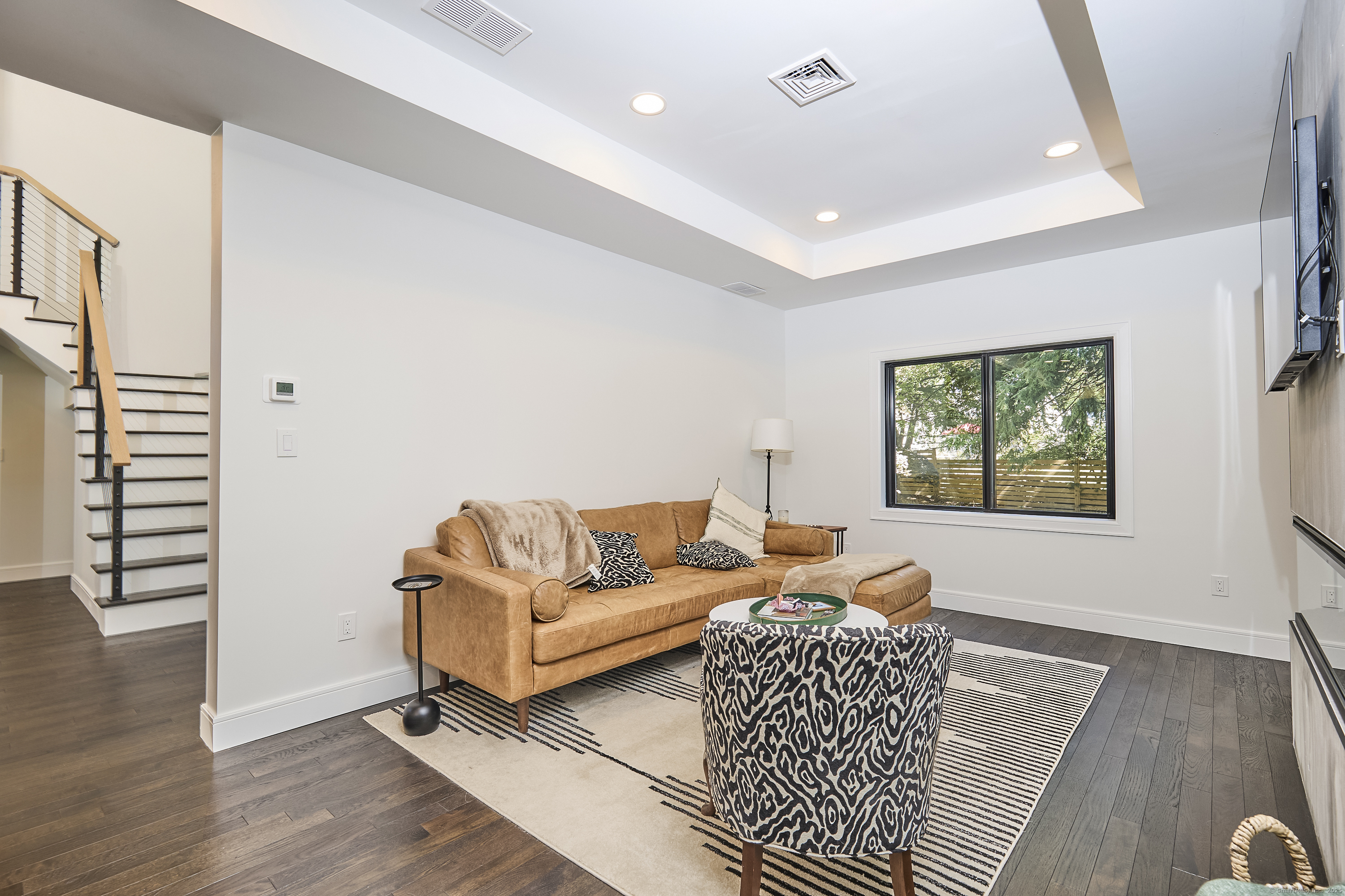 1207 Stillson Road Fairfield, CT 06824 - Photo 12 of 39 a living room with furniture and wooden floor