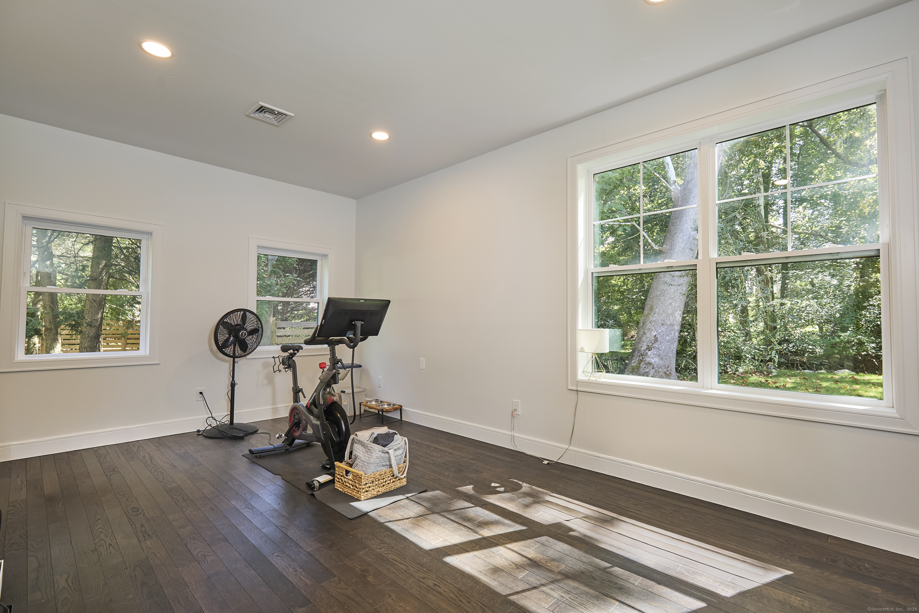 1207 Stillson Road Fairfield, CT 06824 - Photo 21 of 39 a view of workspace with wooden floor windows