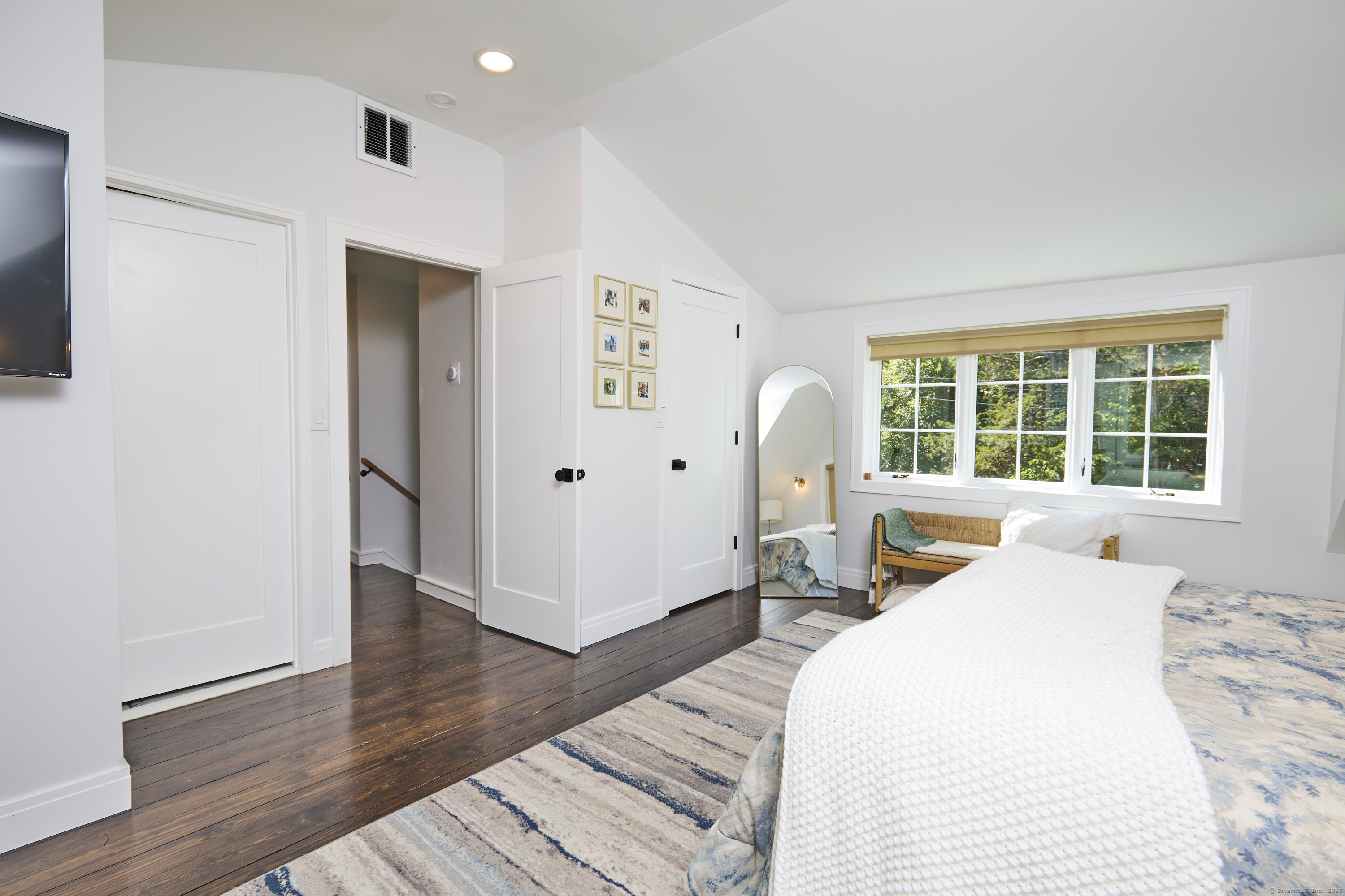 1207 Stillson Road Fairfield, CT 06824 - Photo 23 of 39 a bedroom with a bed and a large window