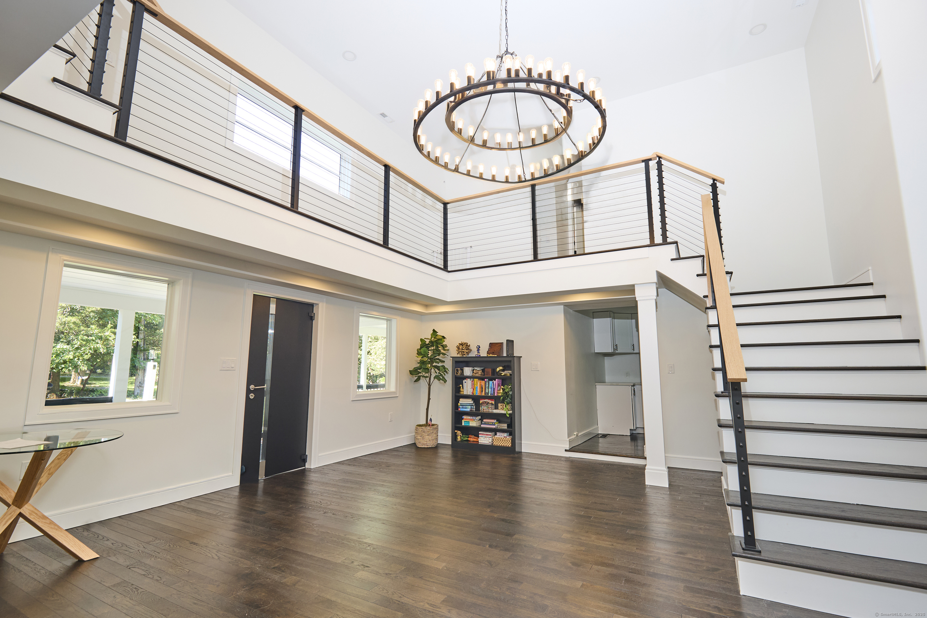 1207 Stillson Road Fairfield, CT 06824 - Photo 5 of 39 a view of livingroom with furniture wooden floor and windows