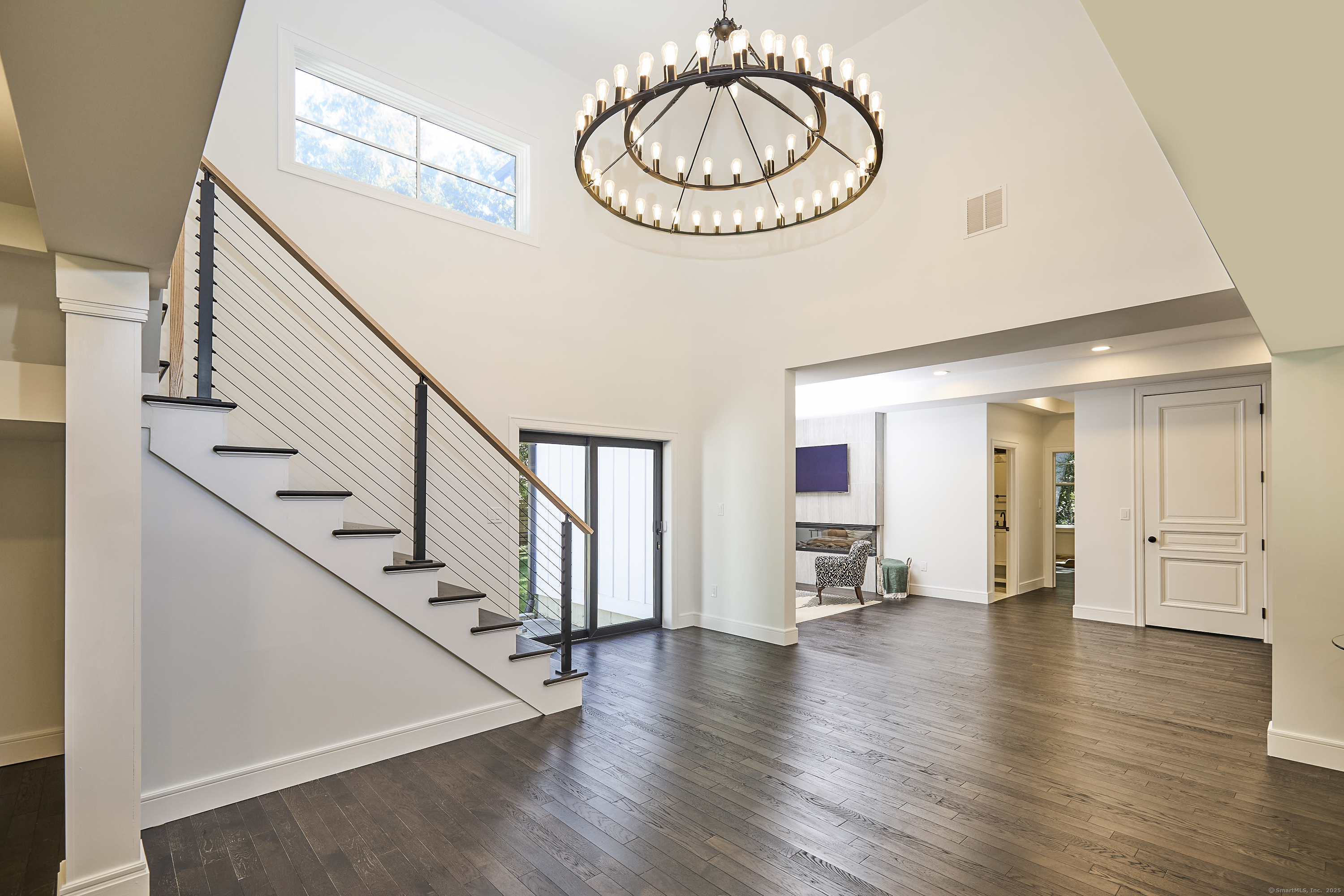 1207 Stillson Road Fairfield, CT 06824 - Photo 6 of 39 a view of an empty room and wooden floor