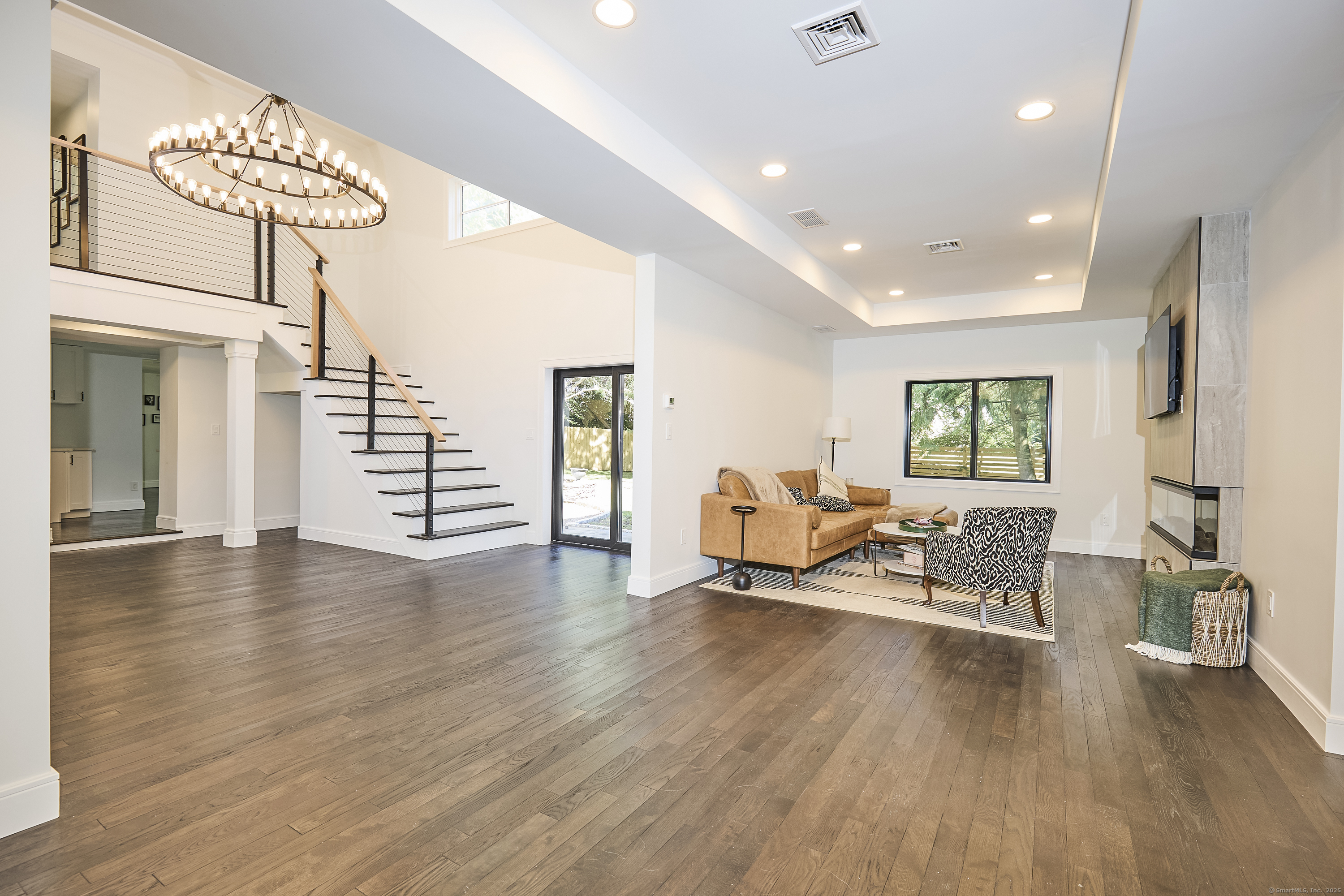 1207 Stillson Road Fairfield, CT 06824 - Photo 10 of 39 a view of a livingroom with furniture and a window