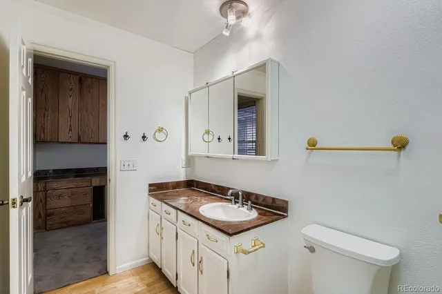 a kitchen with a sink stove and refrigerator