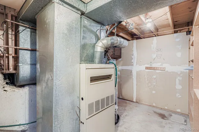 a kitchen with stainless steel appliances granite countertop a refrigerator and a stove