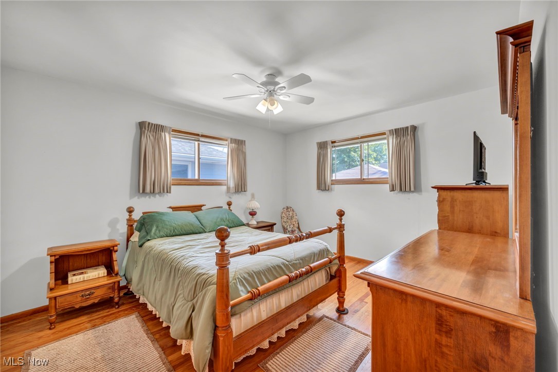 13732 Carpenter Road Garfield Heights, OH 44125 - Photo 5 of 46 Bedroom with light wood finished floors and ceiling fan