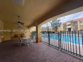 a view of a patio with a table and chairs