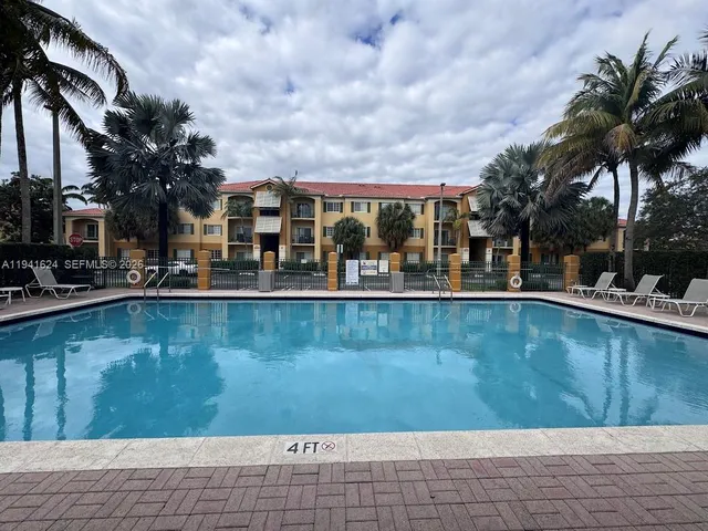a view of a swimming pool with a patio