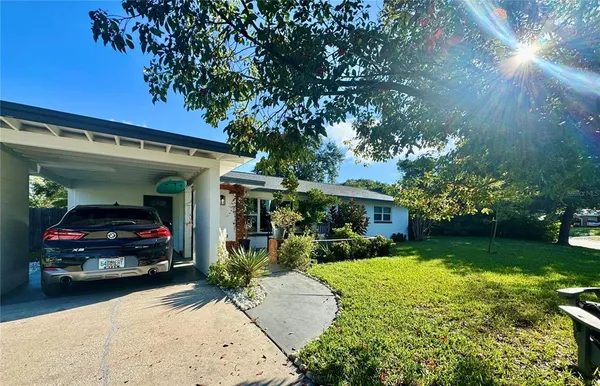a kitchen with stainless steel appliances kitchen island granite countertop a stove a sink and a microwave