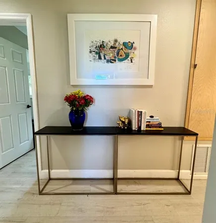 a white toilet sitting next to a bathroom sink and a shower