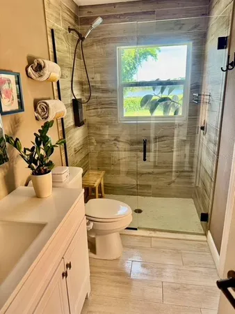 a living room with furniture and a lamp