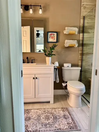 a bedroom with a bed and lamp