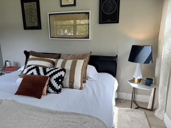 a view of a chair and table in the garden