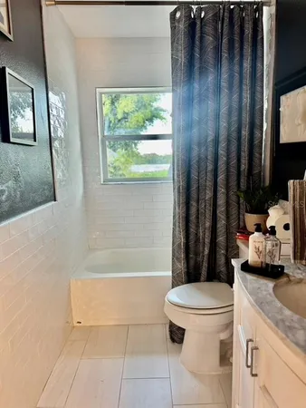 a view of backyard of house with seating space