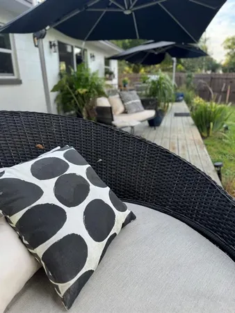 a view of a garden with lawn chairs