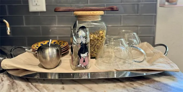 a view of an outdoor sitting area with furniture and umbrella