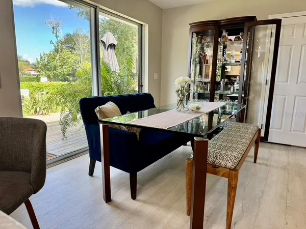 a view of a dining room with furniture window and wooden floor