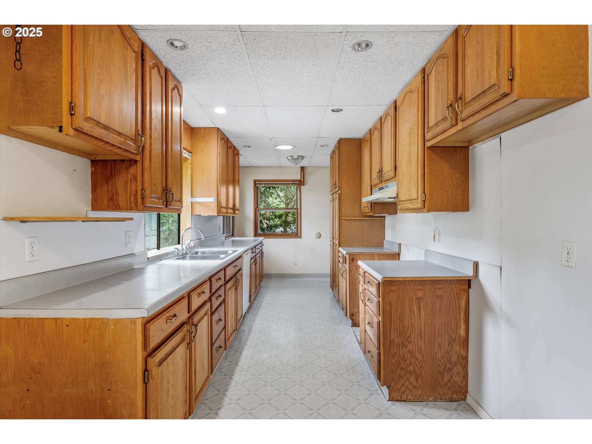 15051 Southeast Bluff Road Sandy, OR 97055 - Photo 12 of 41 a kitchen with stainless steel appliances granite countertop a sink a stove and a refrigerator