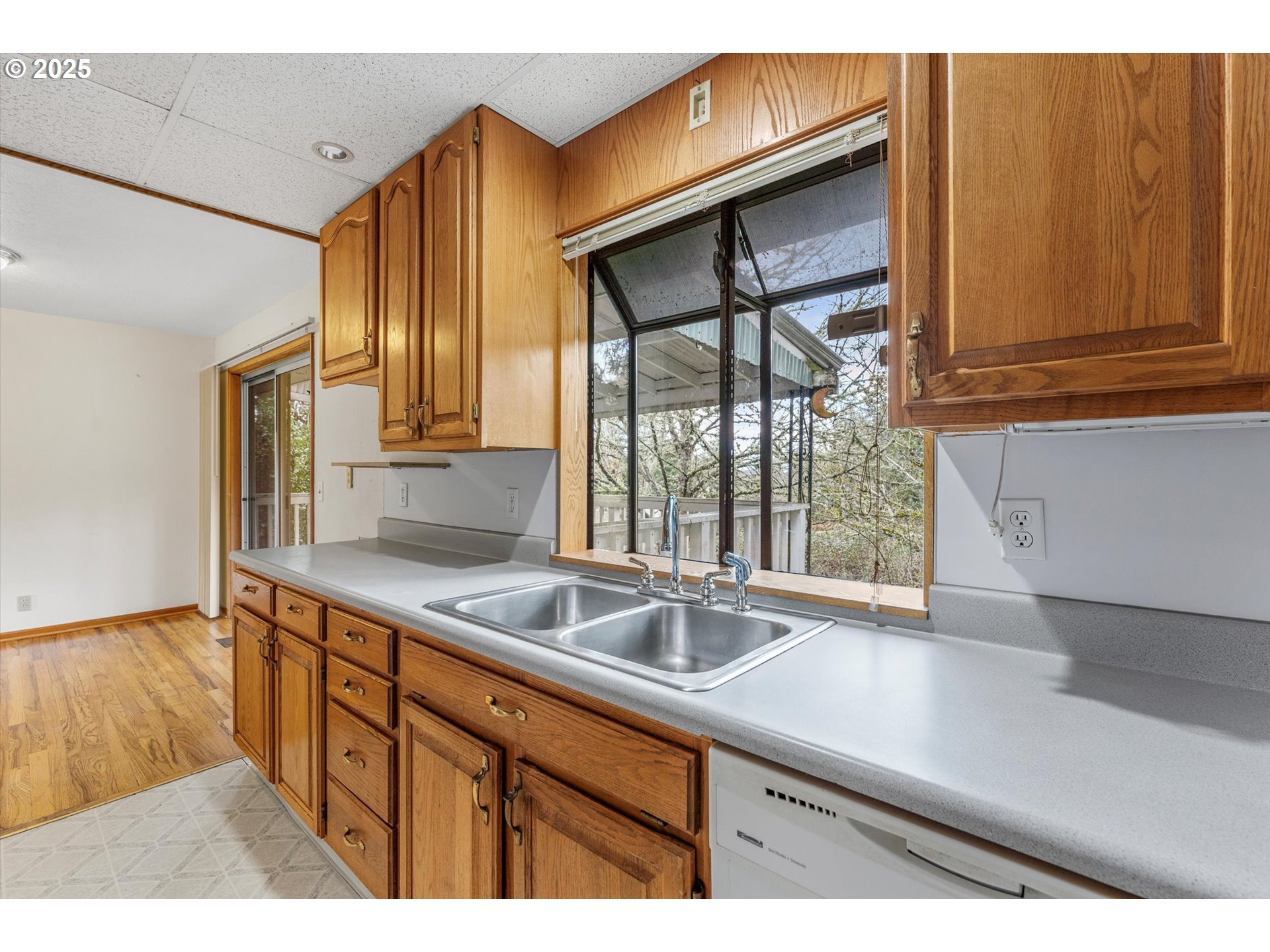 15051 Southeast Bluff Road Sandy, OR 97055 - Photo 15 of 41 a kitchen with a sink and a window