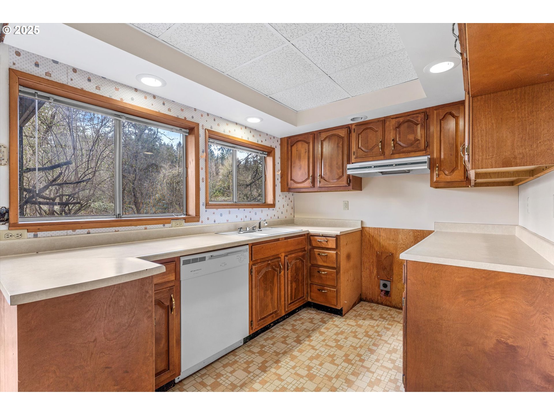 15051 Southeast Bluff Road Sandy, OR 97055 - Photo 24 of 41 a kitchen with sink a window and cabinets