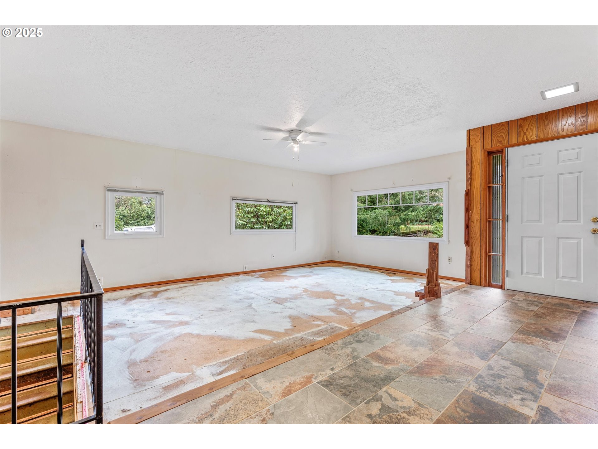 15051 Southeast Bluff Road Sandy, OR 97055 - Photo 9 of 41 a view of a livingroom with wooden floor and a window