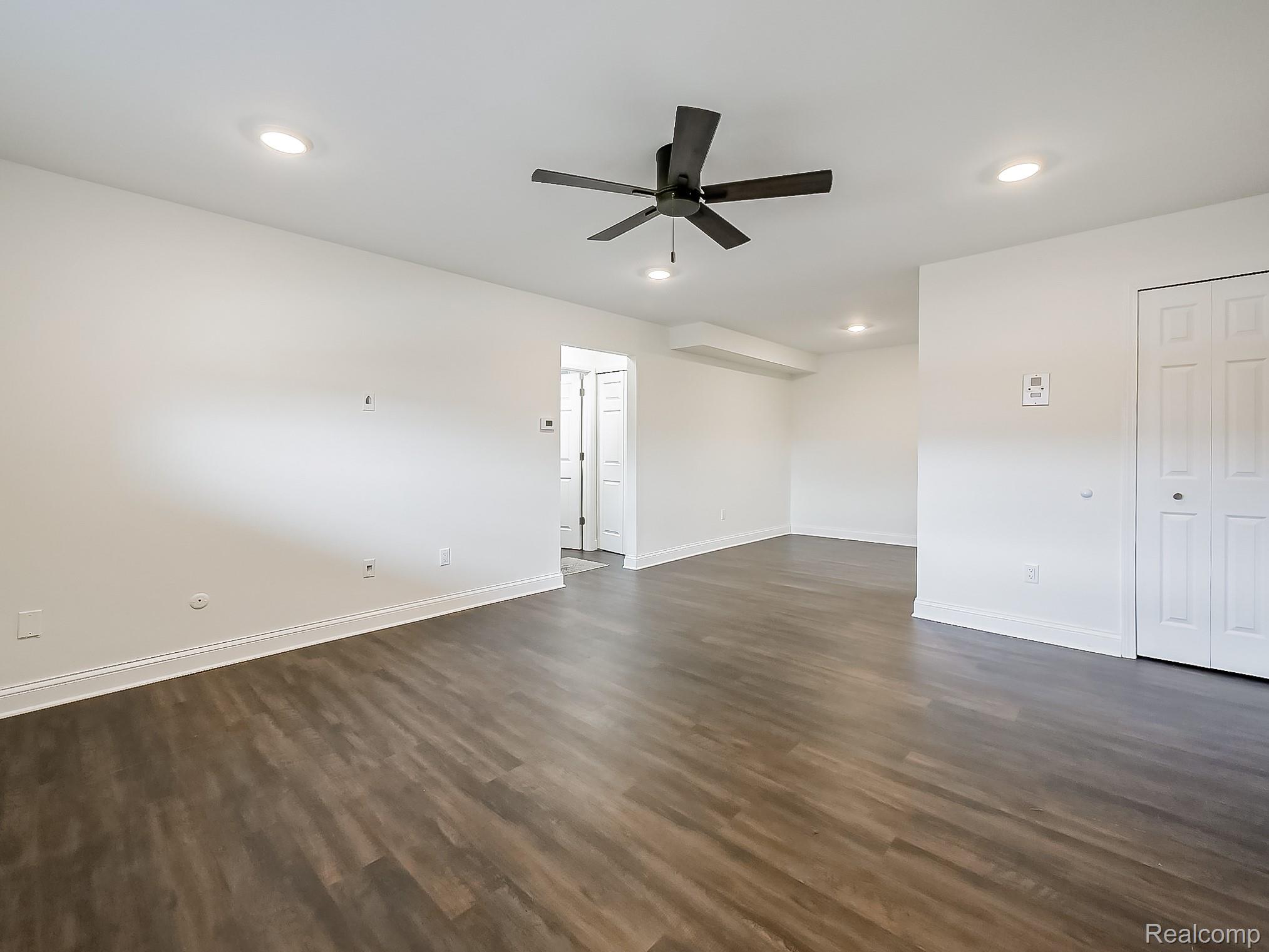 4905 South Crooks Road Royal Oak, MI 48073 - Photo 5 of 28 Spare room featuring ceiling fan, dark wood-style floors, and recessed lighting