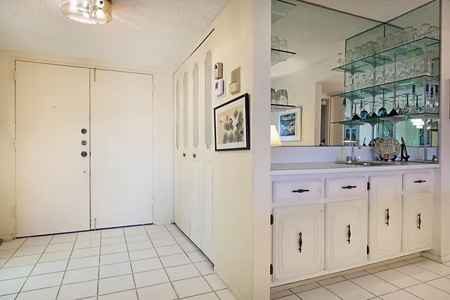 a view of bathroom with a shower and a sink