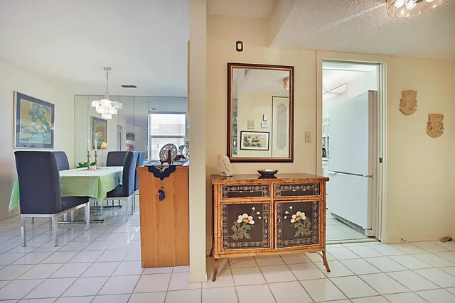 a view of a kitchen area with furniture and wooden floor