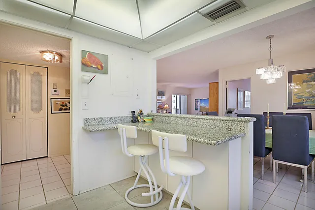 a kitchen with a table and chairs in it