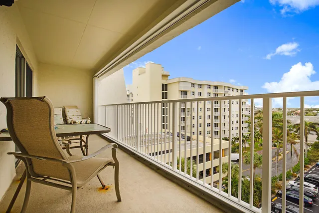 a view of balcony with furniture