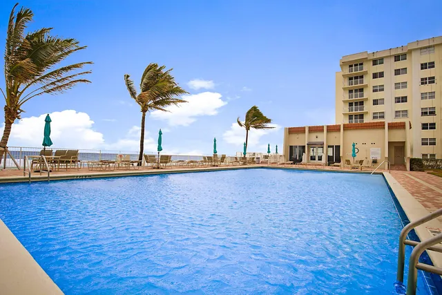 a view of a swimming pool and an outdoor space