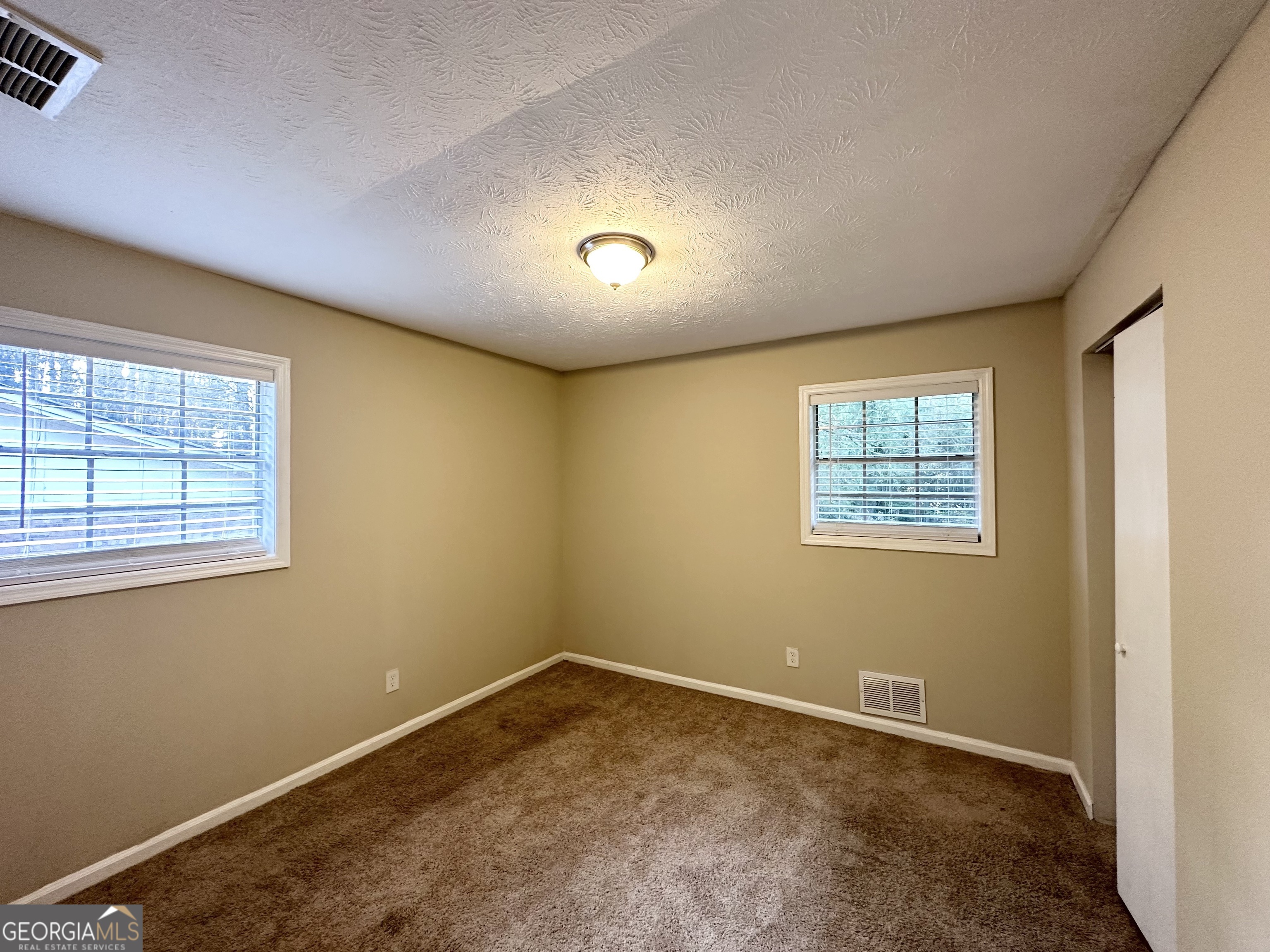 2749 Williamsburg Drive Decatur, GA 30034 - Photo 12 of 14 an empty room with a window