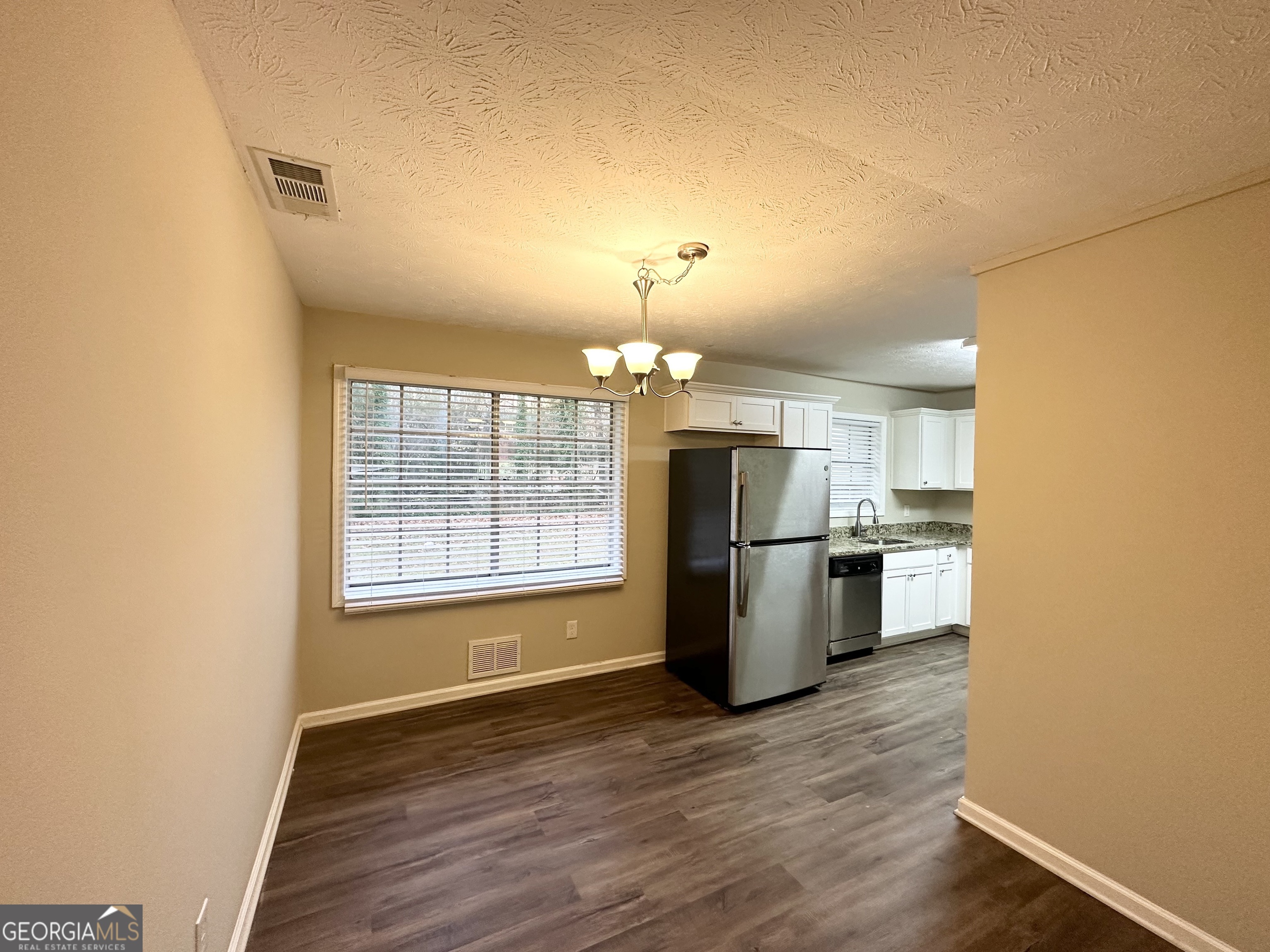 2749 Williamsburg Drive Decatur, GA 30034 - Photo 5 of 14 a view of a kitchen with a refrigerator a stove top oven a sink and dishwasher