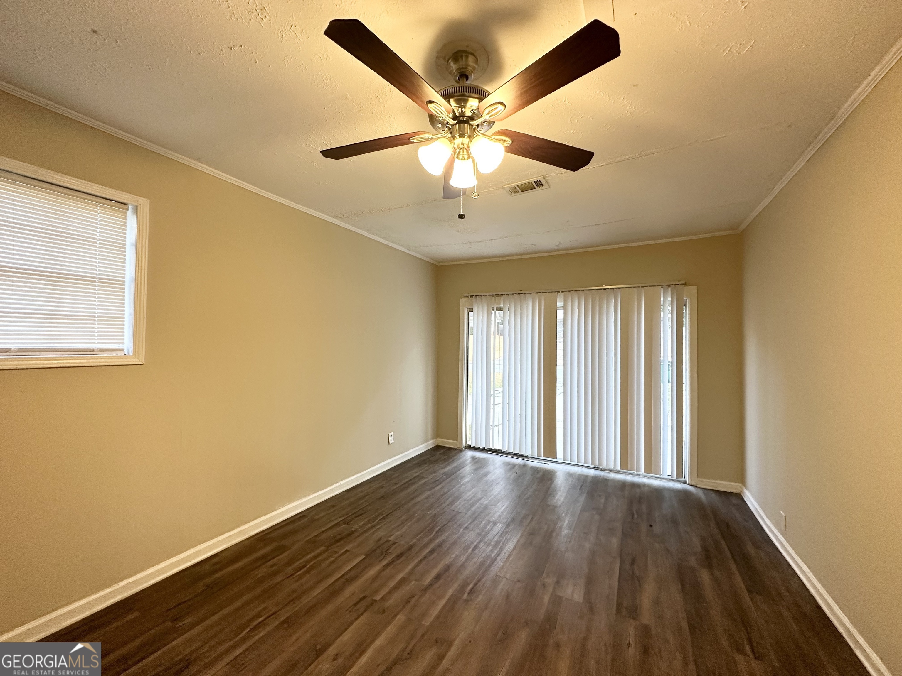 2749 Williamsburg Drive Decatur, GA 30034 - Photo 7 of 14 a view of an empty room with wooden floor and a window