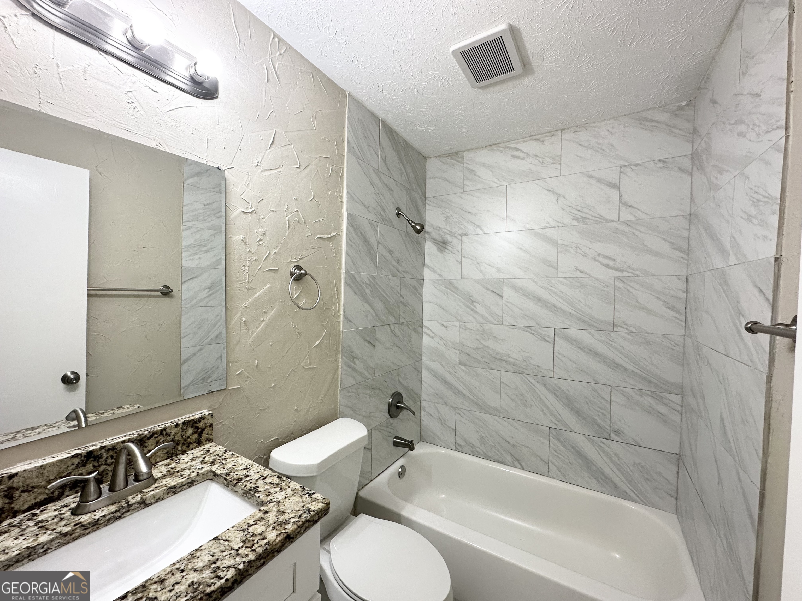 2749 Williamsburg Drive Decatur, GA 30034 - Photo 9 of 14 a bathroom with a granite countertop sink toilet and shower
