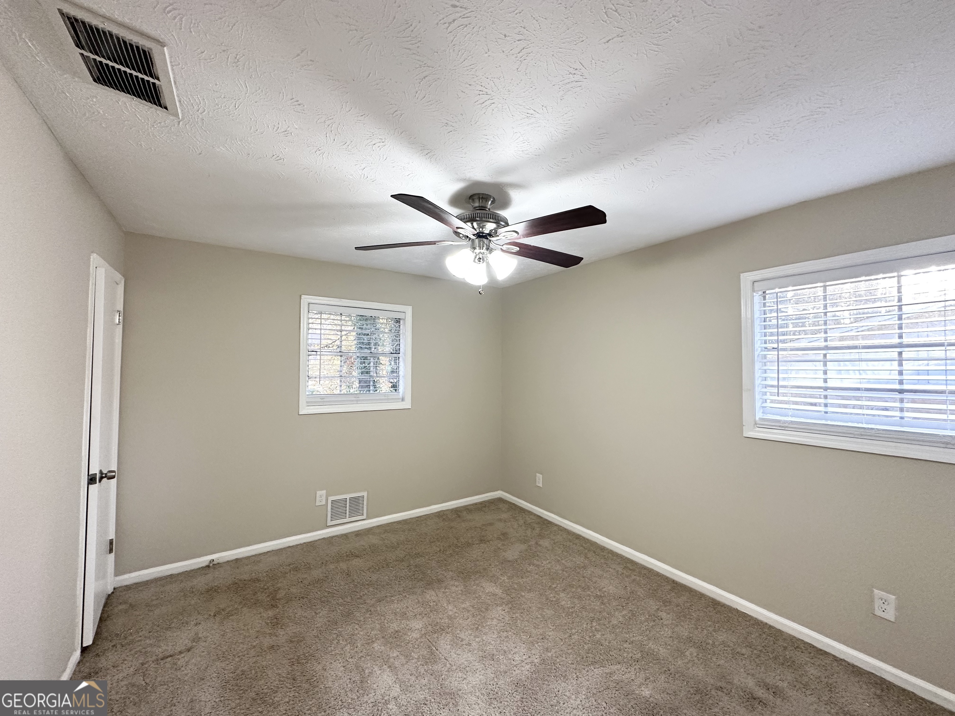 2749 Williamsburg Drive Decatur, GA 30034 - Photo 10 of 14 a view of a livingroom with a ceiling fan and window