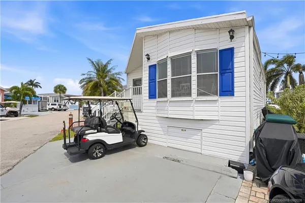 a view of a car park in front of house