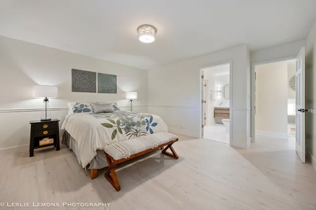 a spacious bedroom with a bed and a window