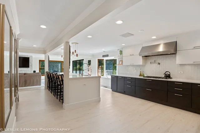 a kitchen with a sink and stainless steel appliances