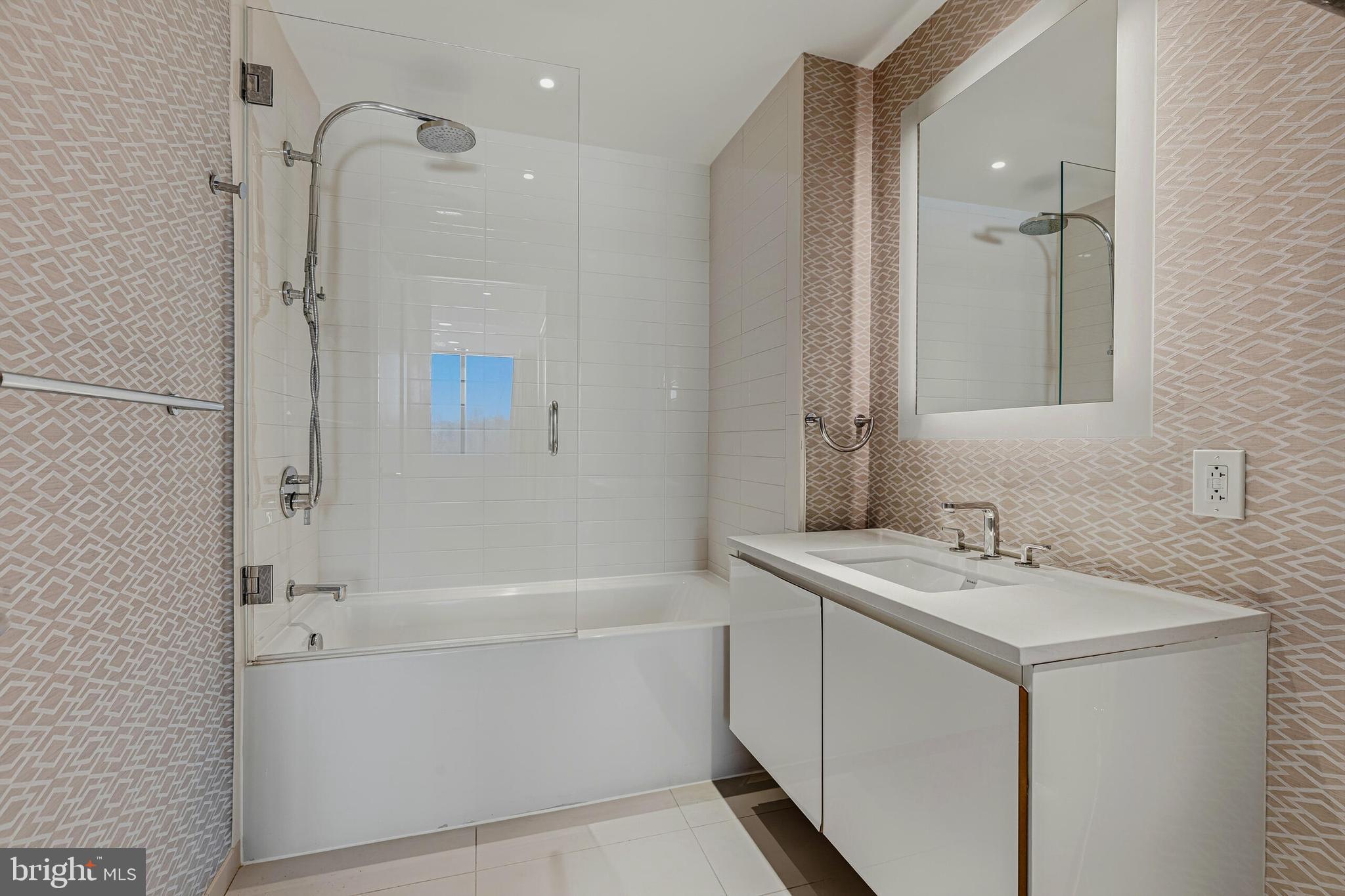 2501 M Street Northwest, Unit 412 Washington, DC 20037 - Photo 23 of 37 Ensuite Bath with Tub Shower